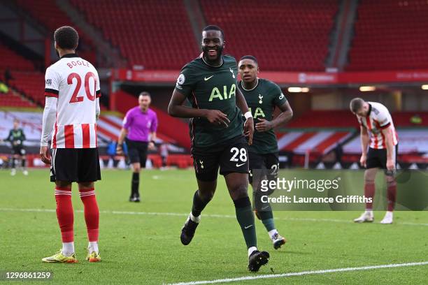 Tanguy NDombele of Tottenham Hotspur celebrates after scoring their team's third goal as Steven Bergwijn looks on during the Premier League match...