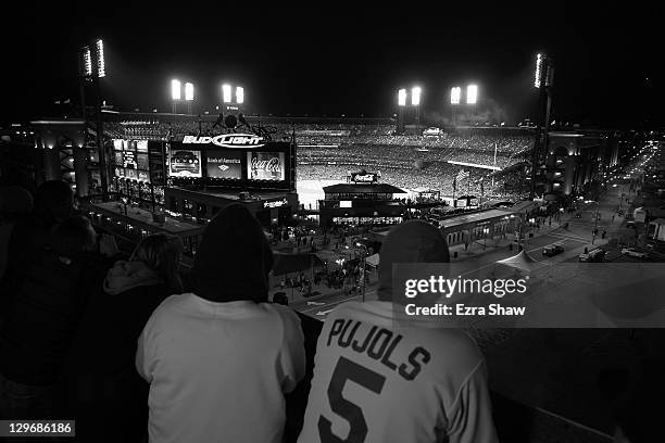 Fans watch the game from outside the stadiuim during Game One of the MLB World Series between the Texas Rangers and the St. Louis Cardinals on...