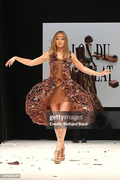 Anca Radici, dressed by Jean-Claude Jeanson, walks the runway during the chocolate dress fashion show celebrating 'Salon du Chocolat 2011' opening...