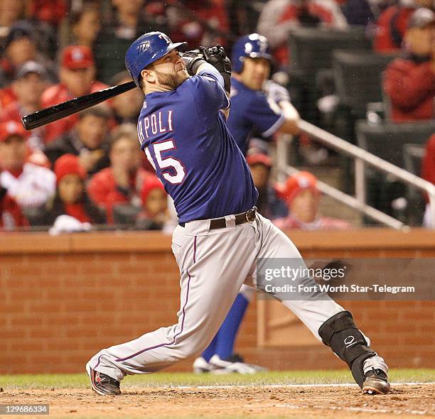 Texas Rangers' Mike Napoli hits a two-run home run in the fifth inning against the St. Louis Cardinals in Game 1 of the World Series at Busch Stadium...