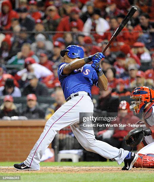 Texas Rangers' Adrian Beltre gets a base hit in the fifth inning against the St. Louis Cardinals in Game 1 of the World Series at Busch Stadium in...