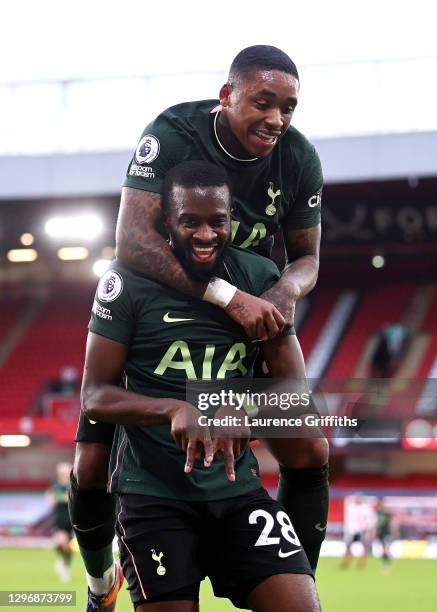 Tanguy Ndombele of Tottenham Hotspur celebrates after scoring their sides third goal with team mate Steven Bergwijn during the Premier League match...