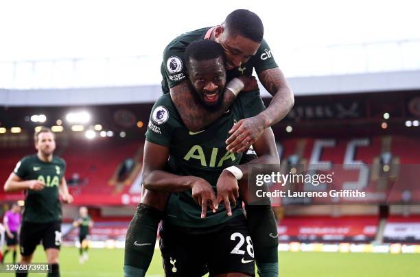 Tanguy Ndombele of Tottenham Hotspur celebrates after scoring their sides third goal with team mate Steven Bergwijn during the Premier League match...