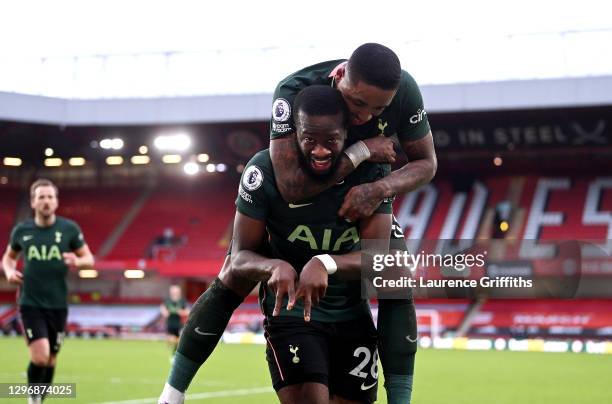 Tanguy Ndombele of Tottenham Hotspur celebrates after scoring their sides third goal with team mate Steven Bergwijn during the Premier League match...