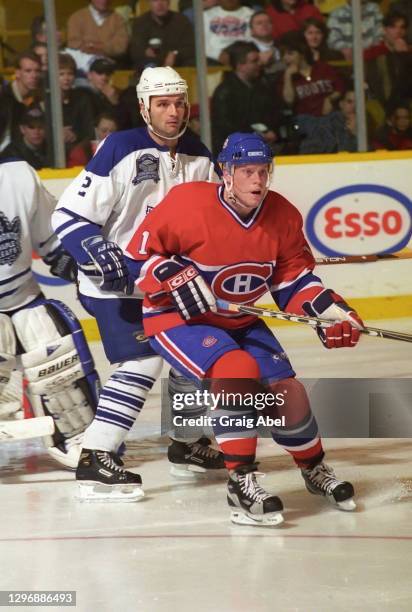 Saku Koivu of the Montreal Canadiens skates against Dallas Eakins of the Toronto Maple Leafs during NHL game action on December 26, 1998 at Maple...