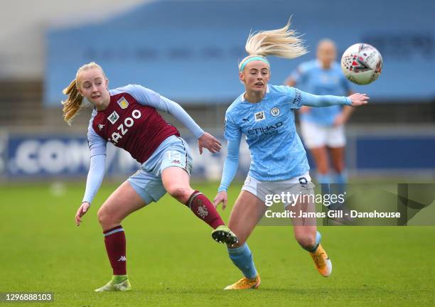 Chloe Kelly of Manchester City Women holds off a challenge from Caroline Siems of Aston Villa Women during the Barclays FA Women's Super League match...