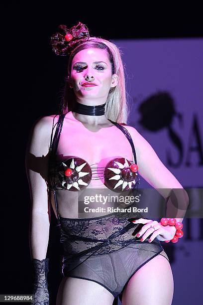 Clara Morgane, dressed by Maxine Wattam and Francois Pralus, walks the runway during the chocolate dress fashion show celebrating 'Salon du Chocolat...