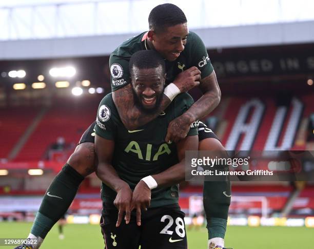 Tanguy Ndombele of Tottenham Hotspur celebrates after scoring their sides third goal with team mate Steven Bergwijn during the Premier League match...
