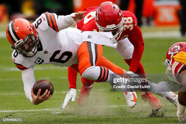 Quarterback Baker Mayfield of the Cleveland Browns is sacked by cornerback L'Jarius Sneed of the Kansas City Chiefs during the first quarter of the...