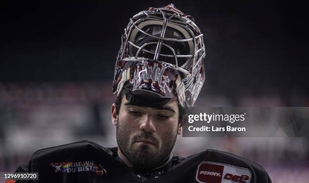 Goalie Hannibal Weizmann looks dejected during the DEL match between Koelner Haie and Pinguins Bremerhaven at LANXESS Arena on January 17, 2021 in...