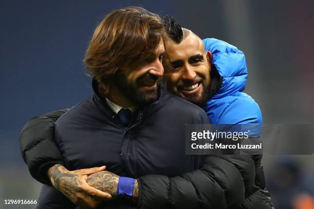 Andrea Pirlo, Head Coach of Juventus interacts with Arturo Vidal of Internazionale following the Serie A match between FC Internazionale and Juventus...