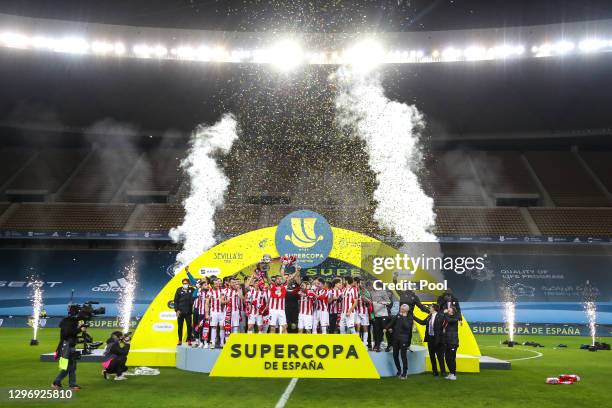 Inigo Martinez of Athletic Bilbao celebrates victory with the Supercopa de Espana trophy after the Supercopa de Espana Final match between FC...