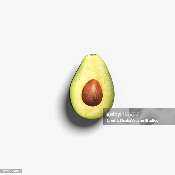 top view of avocado half - avocado fotografías e imágenes de stock