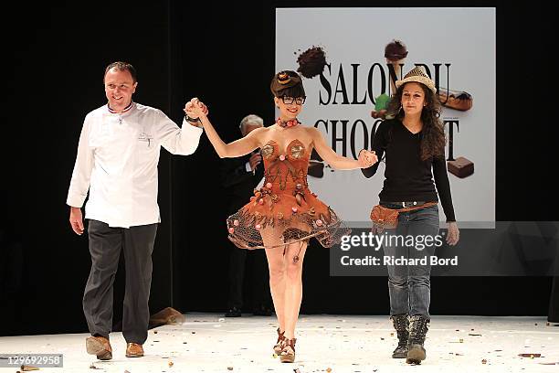 Maya Barsony walks the runway with Amandine Zerbib and Arnaud Larher during the chocolate dress fashion show celebrating 'Salon du Chocolat 2011'...