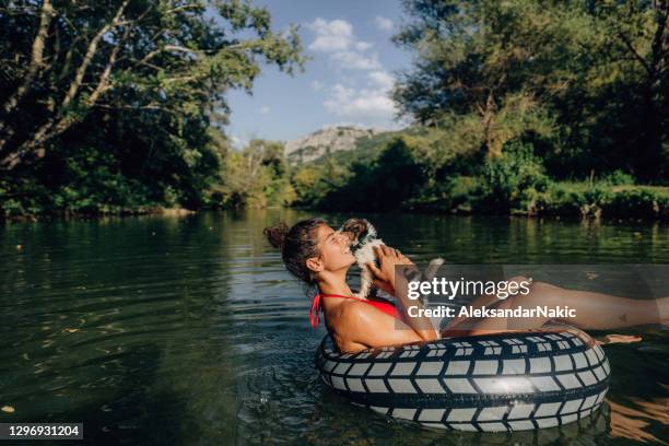 summer lovers - inflatable tube stock pictures, royalty-free photos & images