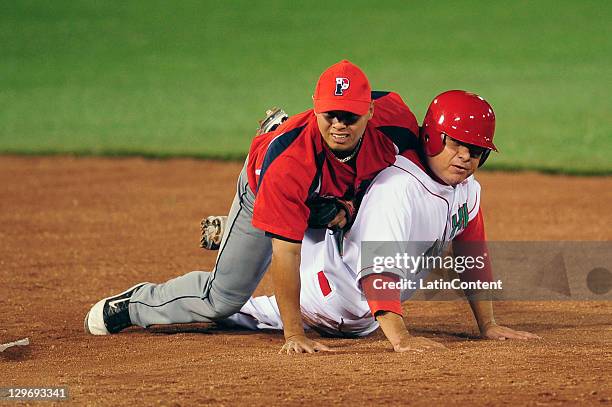 Sergio Gastelum of Mexico and Jeffer Patino of Panama during the 2011 XVI Pan American Games at the Pan American Stadium Baseball on October 17, 2011...