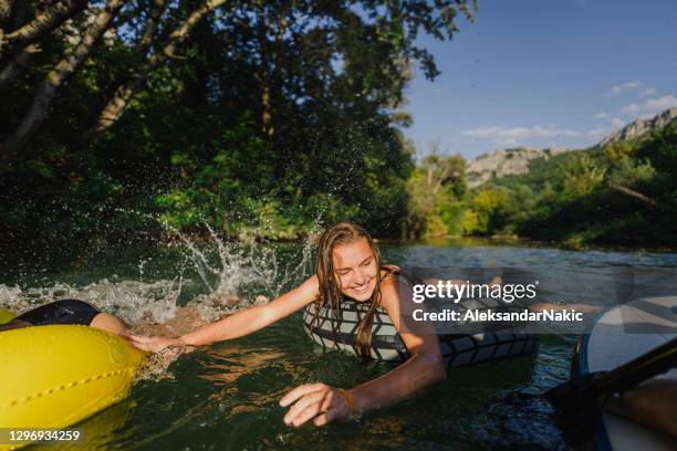 summer vacation - river tubing stock pictures, royalty-free photos & images