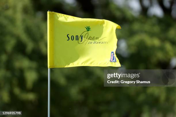 Flag blows in the breeze on the 16th green during the final round of the Sony Open in Hawaii at the Waialae Country Club on January 17, 2021 in...