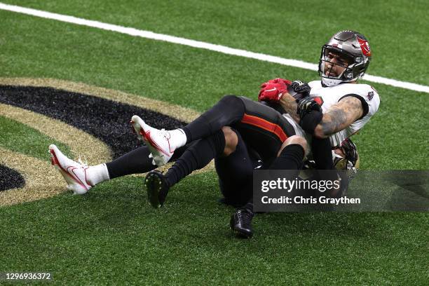 Mike Evans of the Tampa Bay Buccaneers scores a 3 yard touchdown against Marshon Lattimore the New Orleans Saints during the second quarter in the...