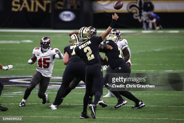 Jameis Winston of the New Orleans Saints throws a pass against the Tampa Bay Buccaneers during the second quarter in the NFC Divisional Playoff game...