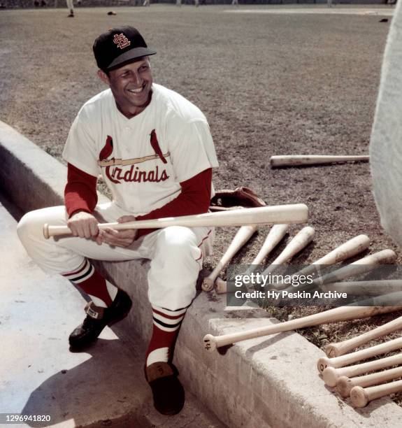 Stan Musial of the St. Louis Cardinals poses for a portrait on the dugout steps during Spring Training circa March, 1958 in St. Petersburg, Florida.