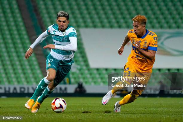 Diego Valdes of Santos fights for the ball with Carlos Salcedo of Tigres during the 2nd round match between Santos Laguna and Tigres UANL as part of...