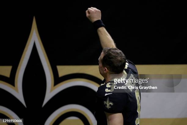 Drew Brees of the New Orleans Saints acknowledges the crowd after being defeated by the Tampa Bay Buccaneers in the NFC Divisional Playoff game at...