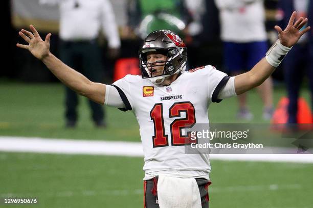 Tom Brady of the Tampa Bay Buccaneers celebrates a first down against the New Orleans Saints late in the fourth quarter in the NFC Divisional Playoff...