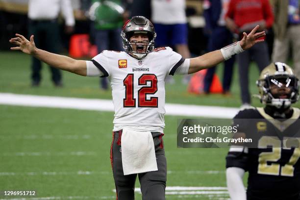 Tom Brady of the Tampa Bay Buccaneers celebrates a first down against the New Orleans Saints late in the fourth quarter in the NFC Divisional Playoff...