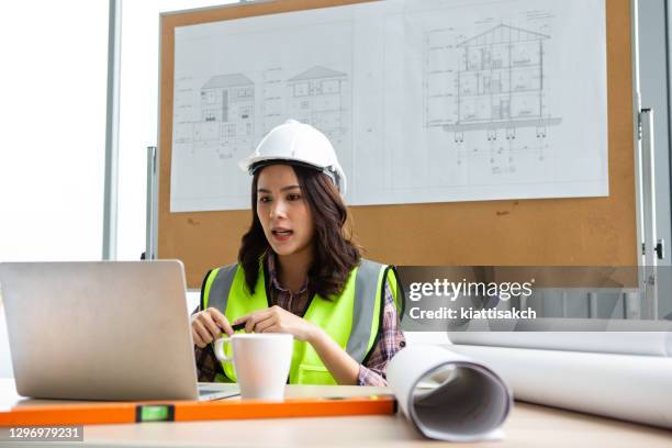 Engineer Or Architect With Protective Workwear Using Laptop For Video ...