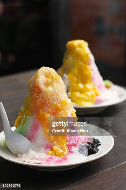 mango and durian ice kacang - mango shaved ice stock pictures, royalty-free photos & images