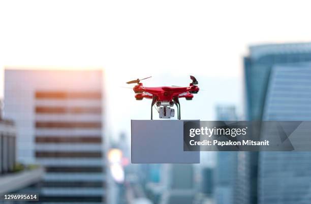 innovation breakthrough cargo drone in the air cargo industry - drone parcel stock pictures, royalty-free photos & images