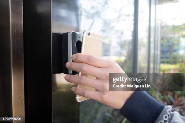 use mobile phone instead of key to open door - validation stock pictures, royalty-free photos & images