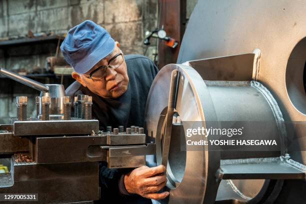 the flowers still bloom when they are old. an ironworks alone in downtown. - old factory stock pictures, royalty-free photos & images