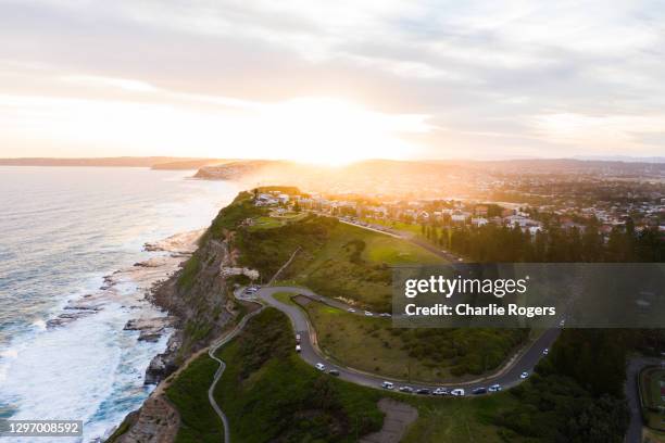 newcastle coast at sunset - bundesstaat new south wales stock-fotos und bilder