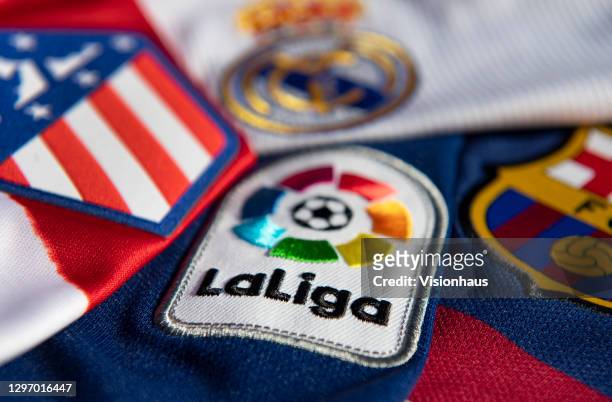 The La Liga logo with the Atlético Madrid, Real Madrid and FC Barcelona club badges on the first team home shirts on January 12, 2021 in Manchester,...