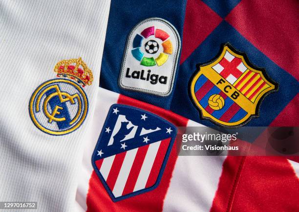 The La Liga logo with the Real Madrid, Atlético Madrid and FC Barcelona club badges on the first team home shirts on January 12, 2021 in Manchester,...