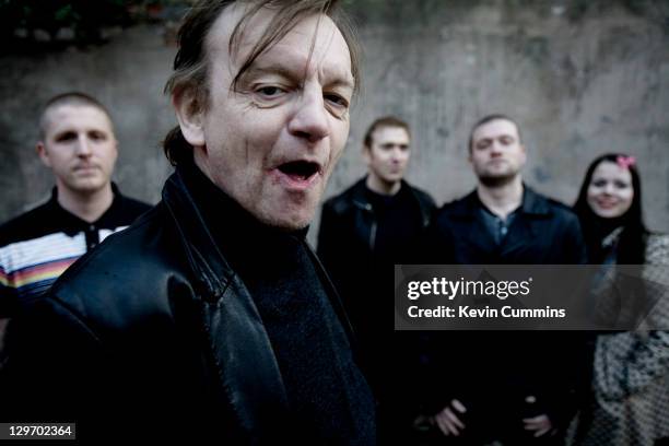 Manchester musician Mark E Smith poses with other members of The Fall, Salford, Manchester, 18th March 2011.