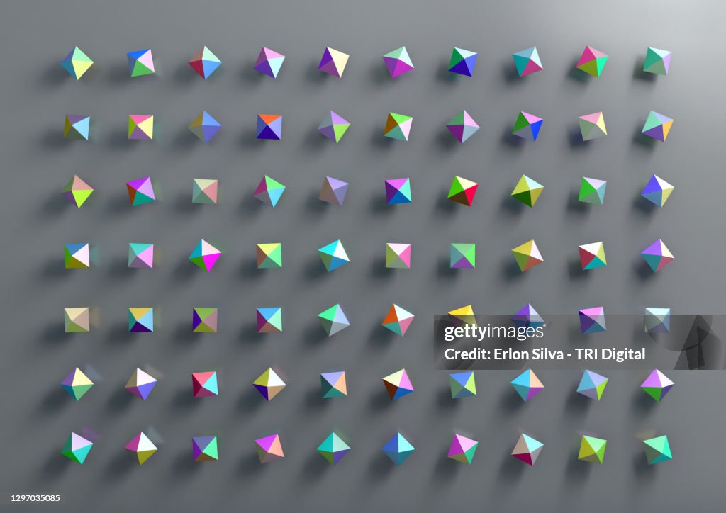 Graphic design of multicolored polygonal geometric shapes on gray background