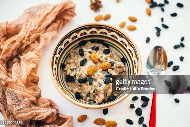 sweet millet porridge with dried fruits - mijo fotografías e imágenes de stock