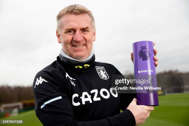 Dean Smith, head coach of Aston Villa poses for a picture with the Manager of the Month Award at Aston Villa's training ground on January 18, 2021 in...