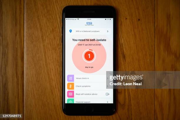 An alert on the official NHS Covid-19 Test and Trace app informing the user to quarantine for one day is seen on January 18, 2021 in London, United...