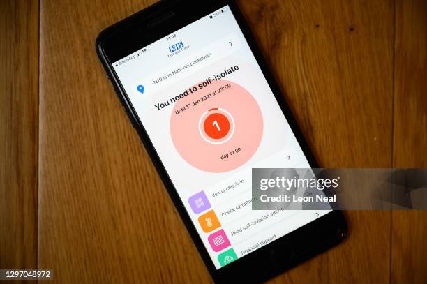 An alert on the official NHS Covid-19 Test and Trace app informing the user to quarantine for one day is seen on January 18, 2021 in London, United...