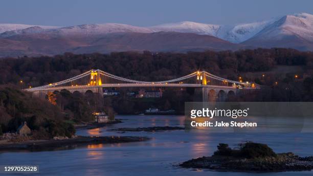 menai bridge at dusk - wales winter stock pictures, royalty-free photos & images