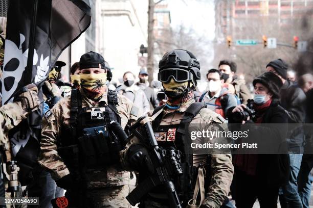 Members of the "boogaloo boys" join other gun rights advocates in front of the State House as pro-gun supporters gather on January 18, 2021 in...