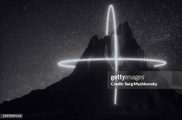 neon shape of a cross over the mountain at night against a background of stars. - cross shape foto e immagini stock