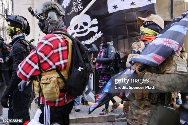 Members of the "boogaloo boys" join other gun rights advocates in front of the State House as pro-gun supporters gather on January 18, 2021 in...