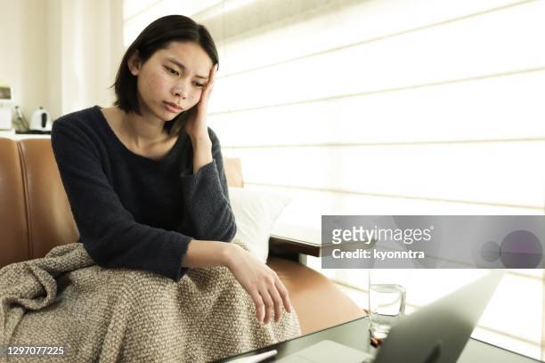 young woman feel sick at home - doctor house call stock pictures, royalty-free photos & images