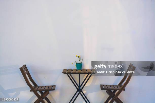 terrace of a cozy and minimalist bar - empty picnic table stock pictures, royalty-free photos & images