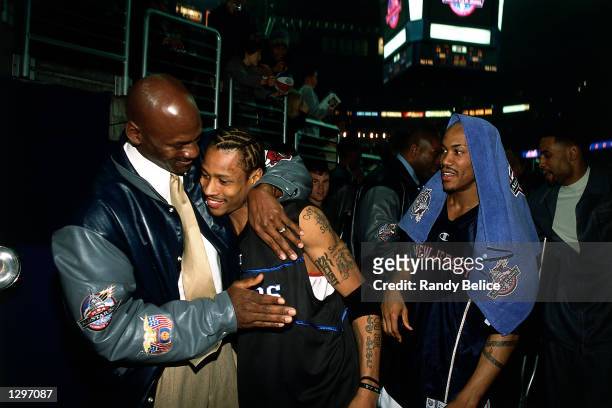 Michael Jordan hugs Allen Iverson of the Philadelphia 76ers after the 2001 NBA All-Star game at the MCI Center in Washington, DC. NOTE TO USER: User...